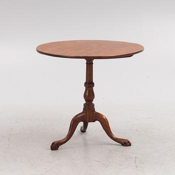 A tilt-top table, 19th century.