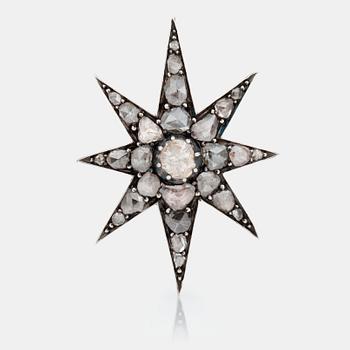 475. A Victorian star brooch set with rose-cut diamonds.