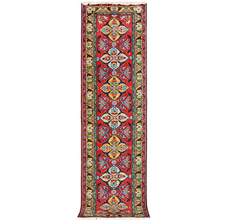 A Kazak runner carpet, c. 344 x 83 cm.
