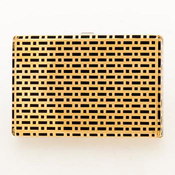 A CARTIER VANITY CASE, 18K gold, enamel, baguette cut diamond. France 1930s.