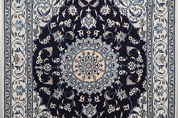 A carpet, Nain, part silk, ca 256 x 199 cm.