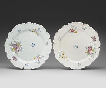 1389. A pair of Swedish faience chargers, Rörstrand, dated 21/11 (17)68 and 6/12 (17)70.