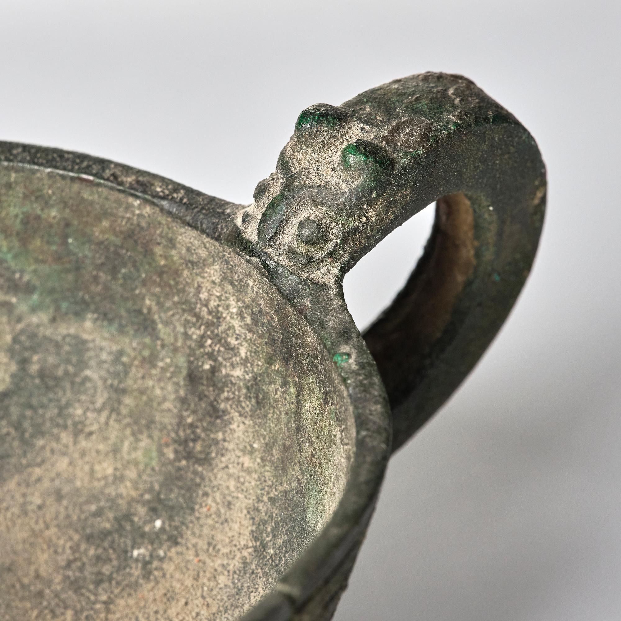 A Chinese brushpot, Qing dynasty, circa 1900. An archaistic bronze ewer and a silvered South East Asian bowl with stand.
