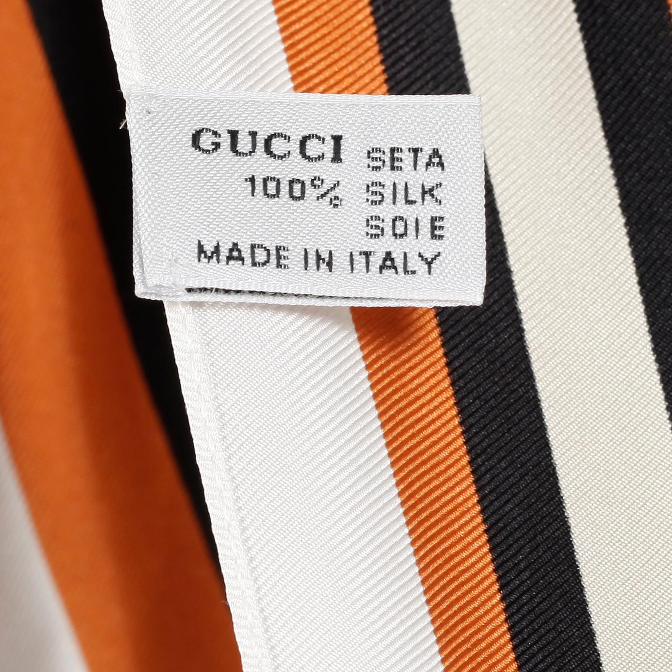GUCCI, a silk top.