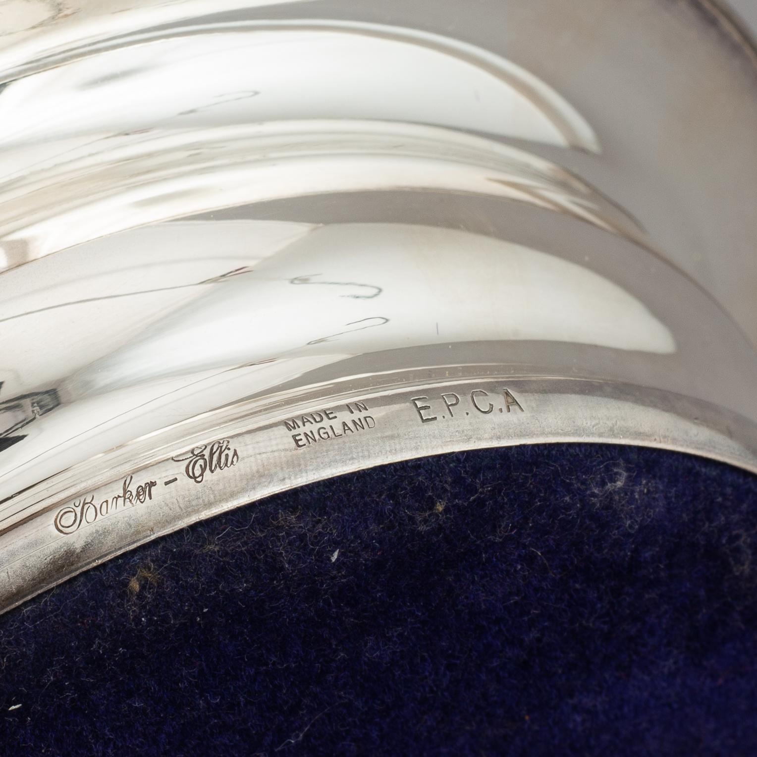 Coasters, two pairs, silver plate, England.