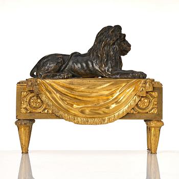 A pair of Louis XVI gilt and patinated bronze chenets.