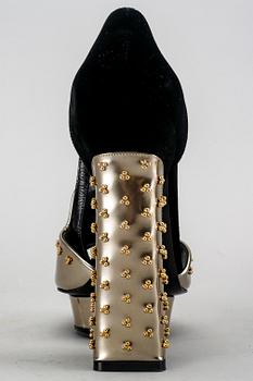 Alexander McQueen, a pair of shoes.
