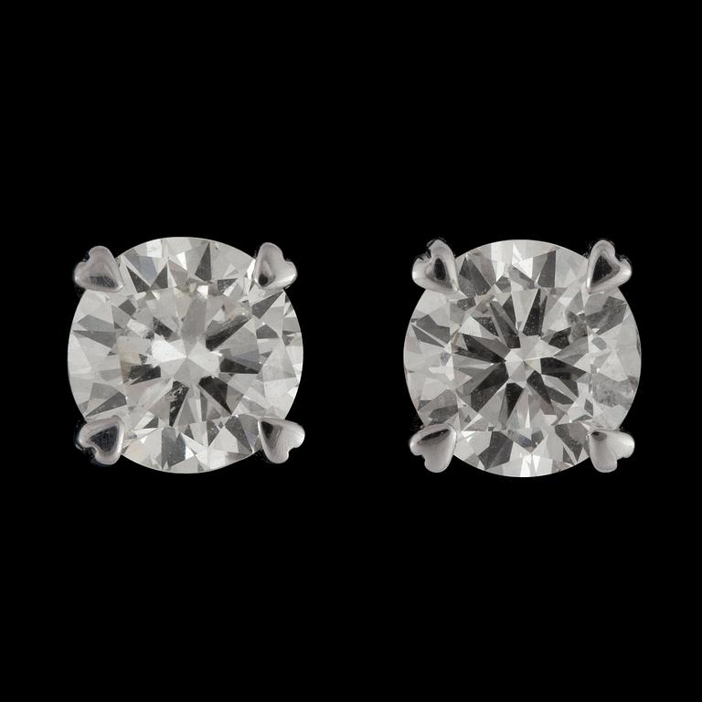 A pair of brilliant cut diamond tot. 2.03 cts earrings. Quality according to certificate K/VVS1-VS1.