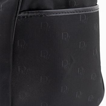 Christian Dior, a black canvas weekend bag.