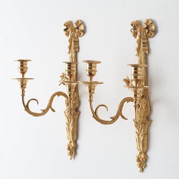 A pair of Louis XVI late 18th century gilt bronze two-light wall-lights.