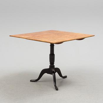 A 19th century folding table with root veneer.