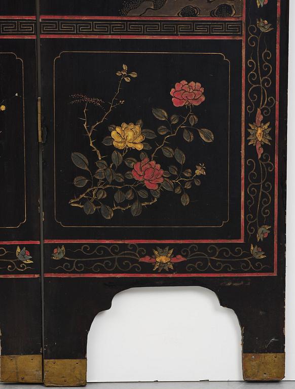 A Chinese four panel lacquer folding screen, first part of the 20th century.