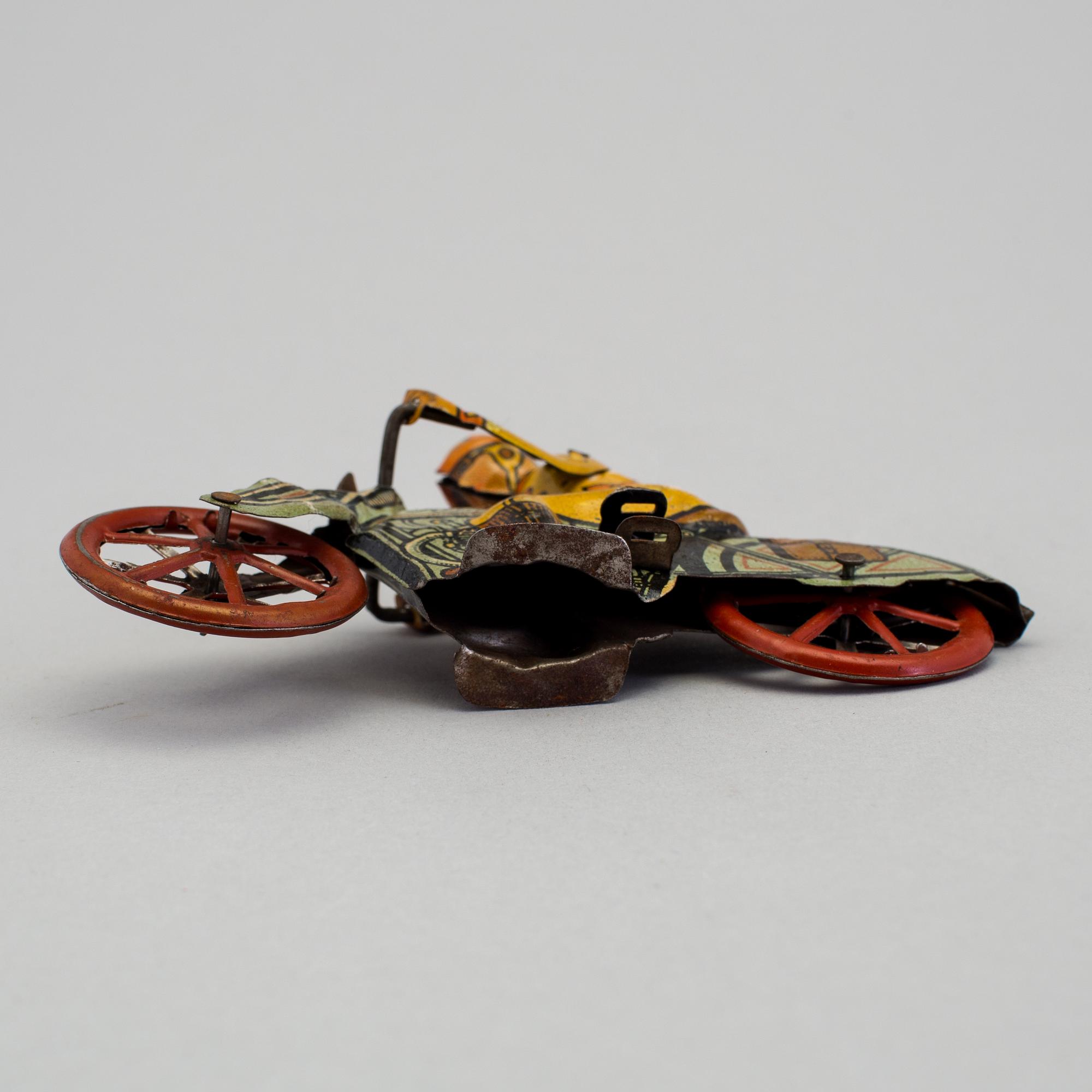 A tinplate Huki roundabout motorcycle, Germany, 1930s.