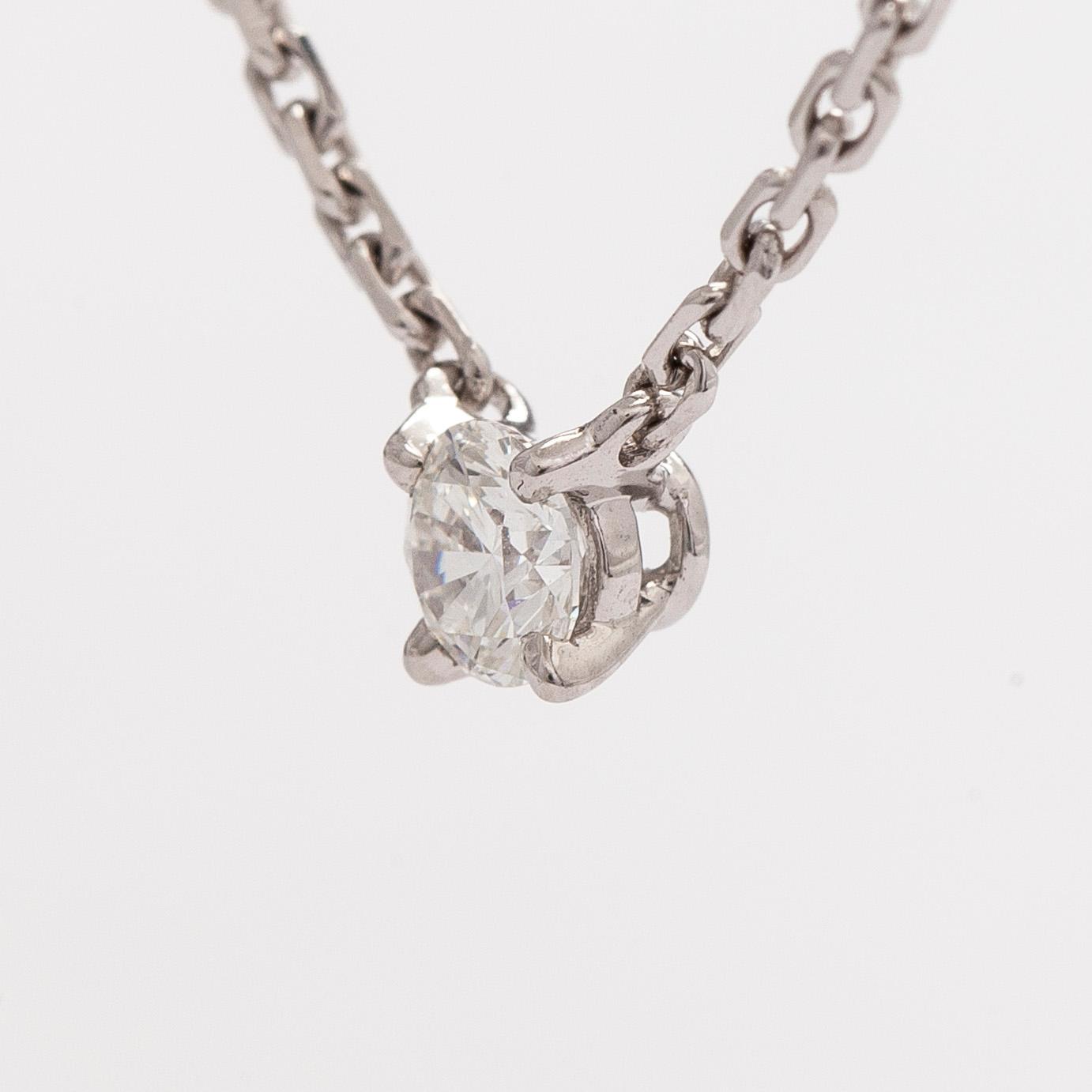Cartier, an 18K white gold '1895' necklace with a brilliant-cut diamond.