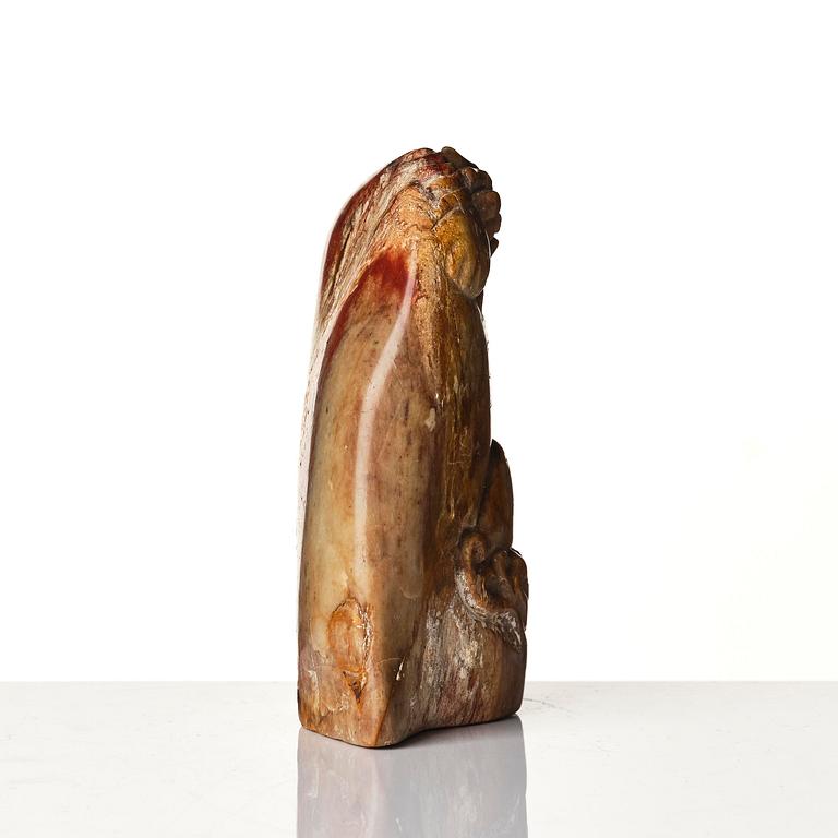 A group of carved nephrite and jade ornaments, China, Qing dynasty and older. (8 pieces).