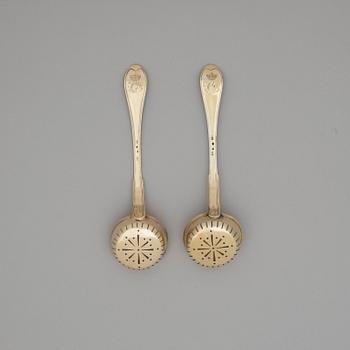 A pair of Swedish 19th century silver-gilt sugar-spoons, makers mark of Gustaf Folker, Stockholm 1824.