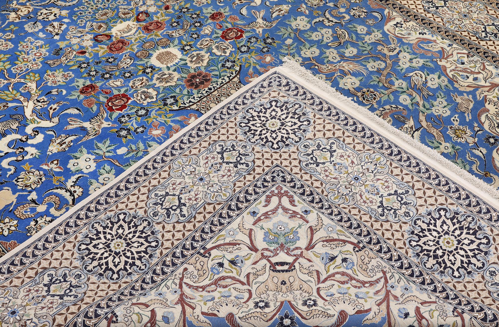 A Figural Nain-Isfahan carpet, part silk, 318 x 213 cm.
