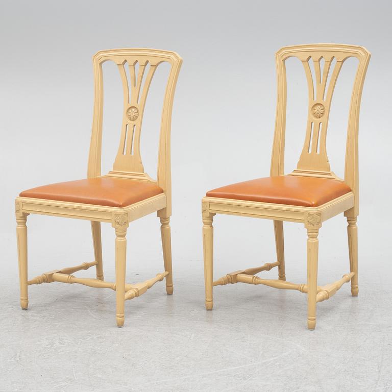 A Gustavian style dining table with six dining chairs, Sweden, 21st century.