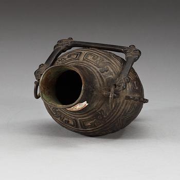 An archaistic bronze vase with a handle, presumably Ming dynasty.