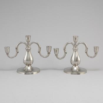 A pair of pewter candelabra from GAB Tenn, Stockholm, 1935.