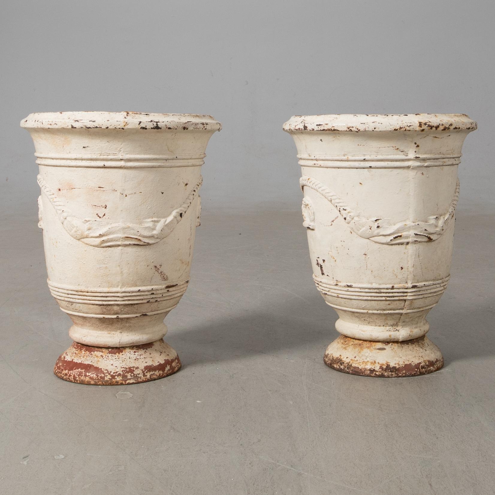 Urnor ett par gjutjärn omkring 1900.