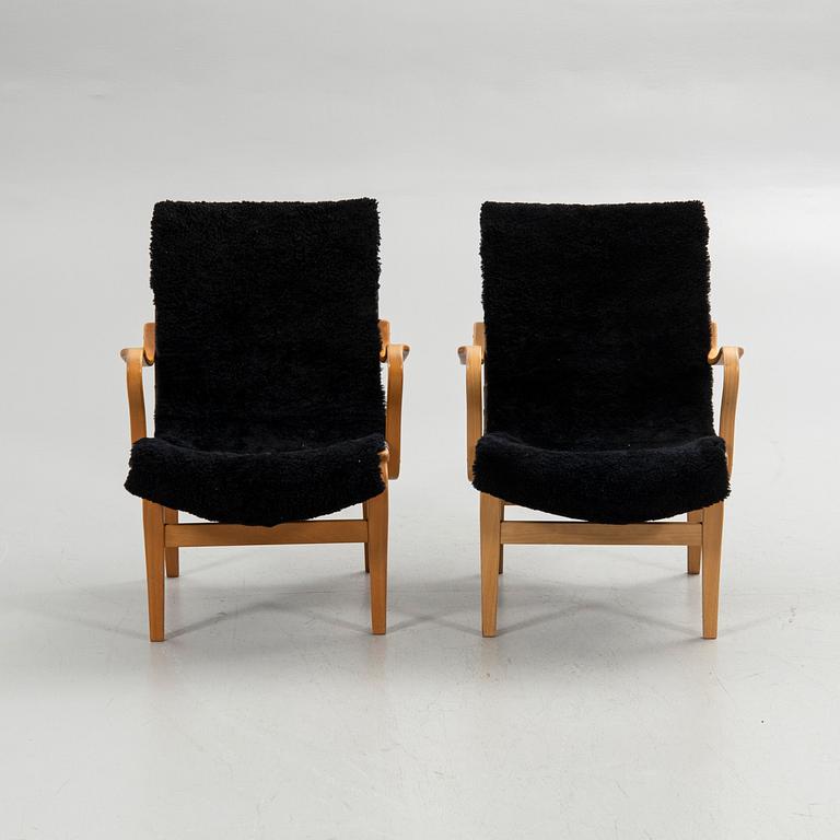 Bruno Mathsson, armchairs, a pair, "Eva", Bruno Mathsson International, Värnamo, second half of the 20th century.