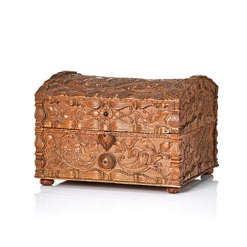 173A. A baroque wedding casket, carved wood, dated 1725.