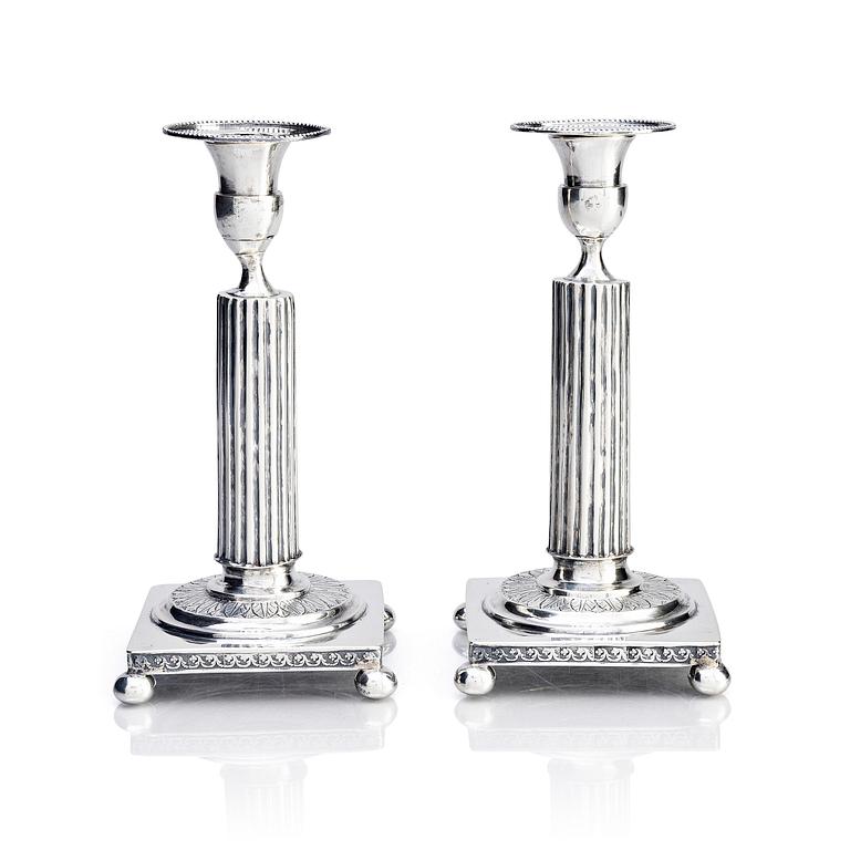 A pair of Gustavian silver candlesticks, unclear maker's mark, the cuffs with mark of Pehr Zethelius, Stockholm 1796.