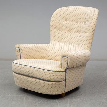 A Carl Malmsten "Jättepaddan" armchair, late 20th or early 21th century.