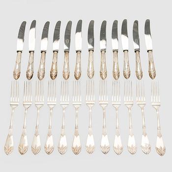 A 24-piece set of silver knives and forks, "Empire", C.G. Hallberg 1903.