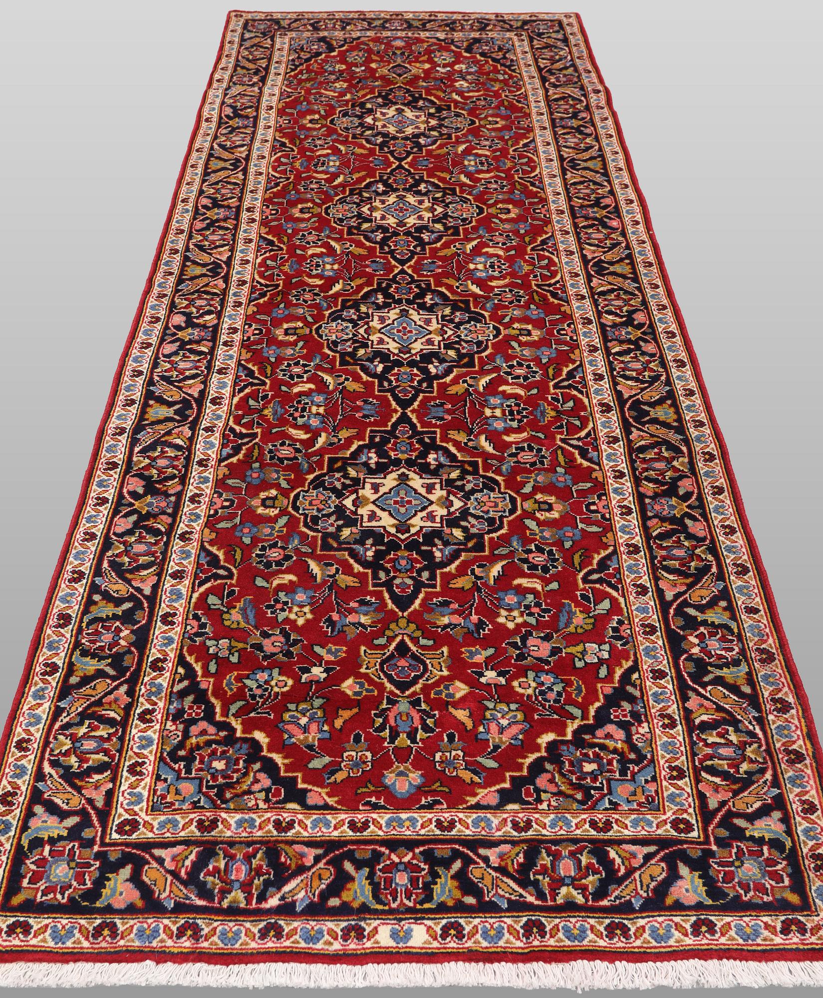 A Keshan runner carpet, 300 x 104 cm.