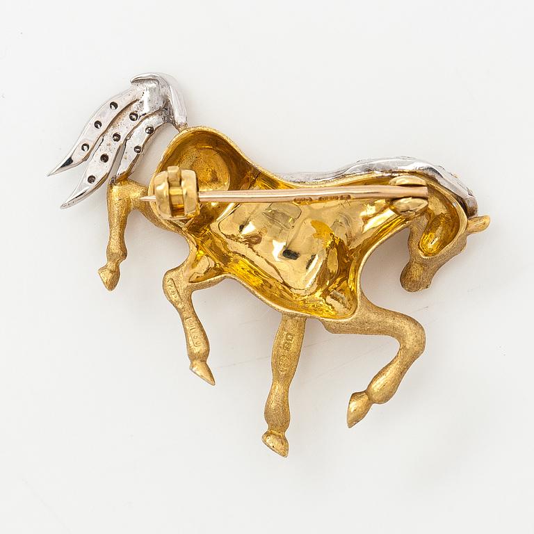 An 18K gold horse brooche with diamonds ca. 0.04 ct in total. United Kingdom.