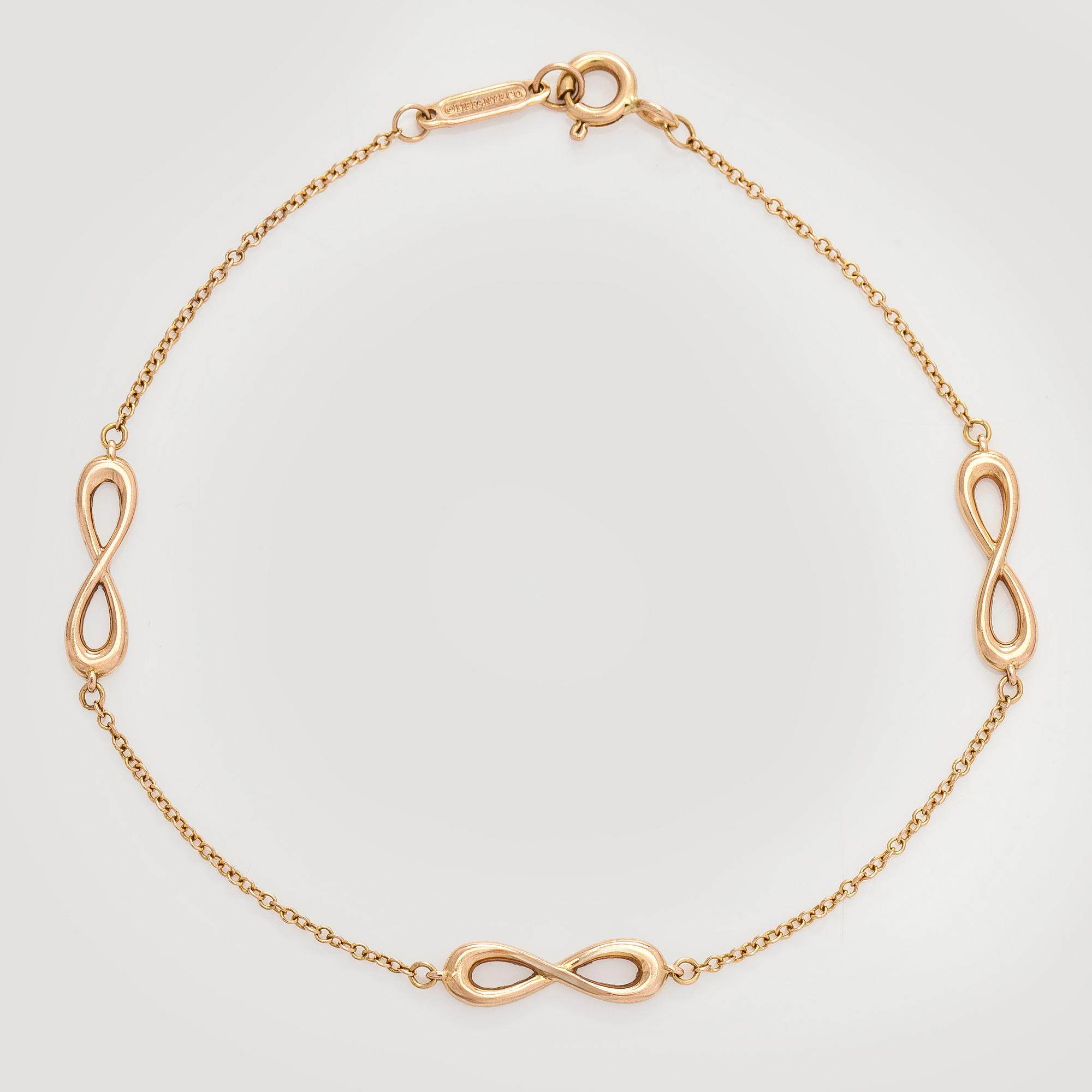 Tiffany & Co, an 18K gold 'Infinity Endless' bracelet.