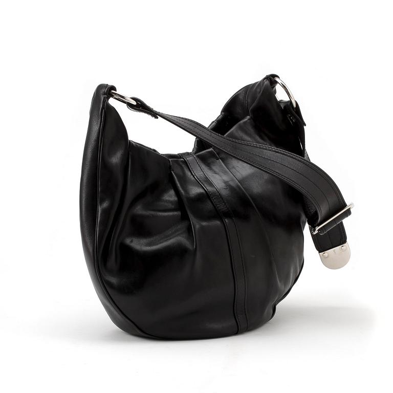 YVES SAINT LAURENT, a black leather shoulder bag.