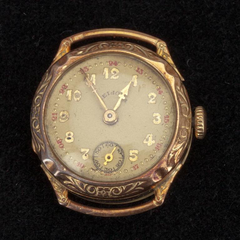 SMYCKEN, ett parti, samt KLOCKA, 8 delar, guld och silver. 1900-talets första hälft. Tot. vikt ca 22 g.