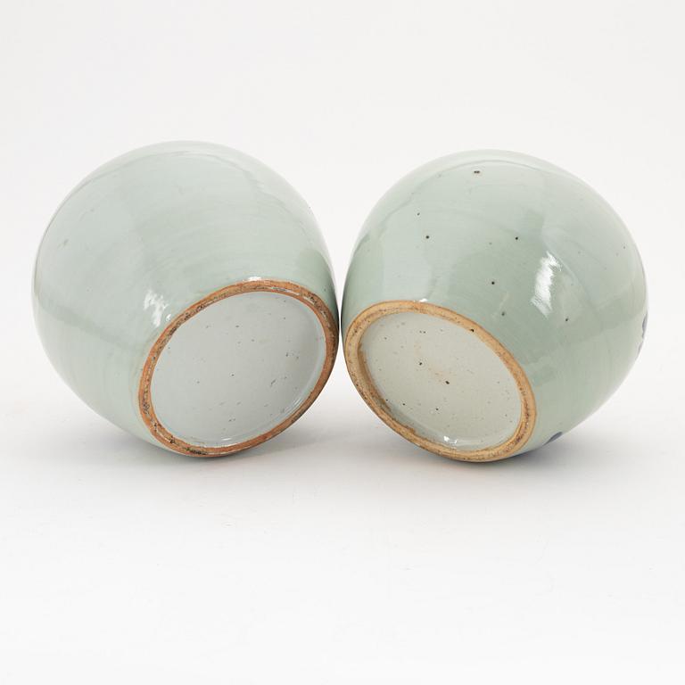 A Chinese a near pair of jars with cover, 20th Century.