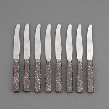 A set of eight porphyr knives, early 20th century.