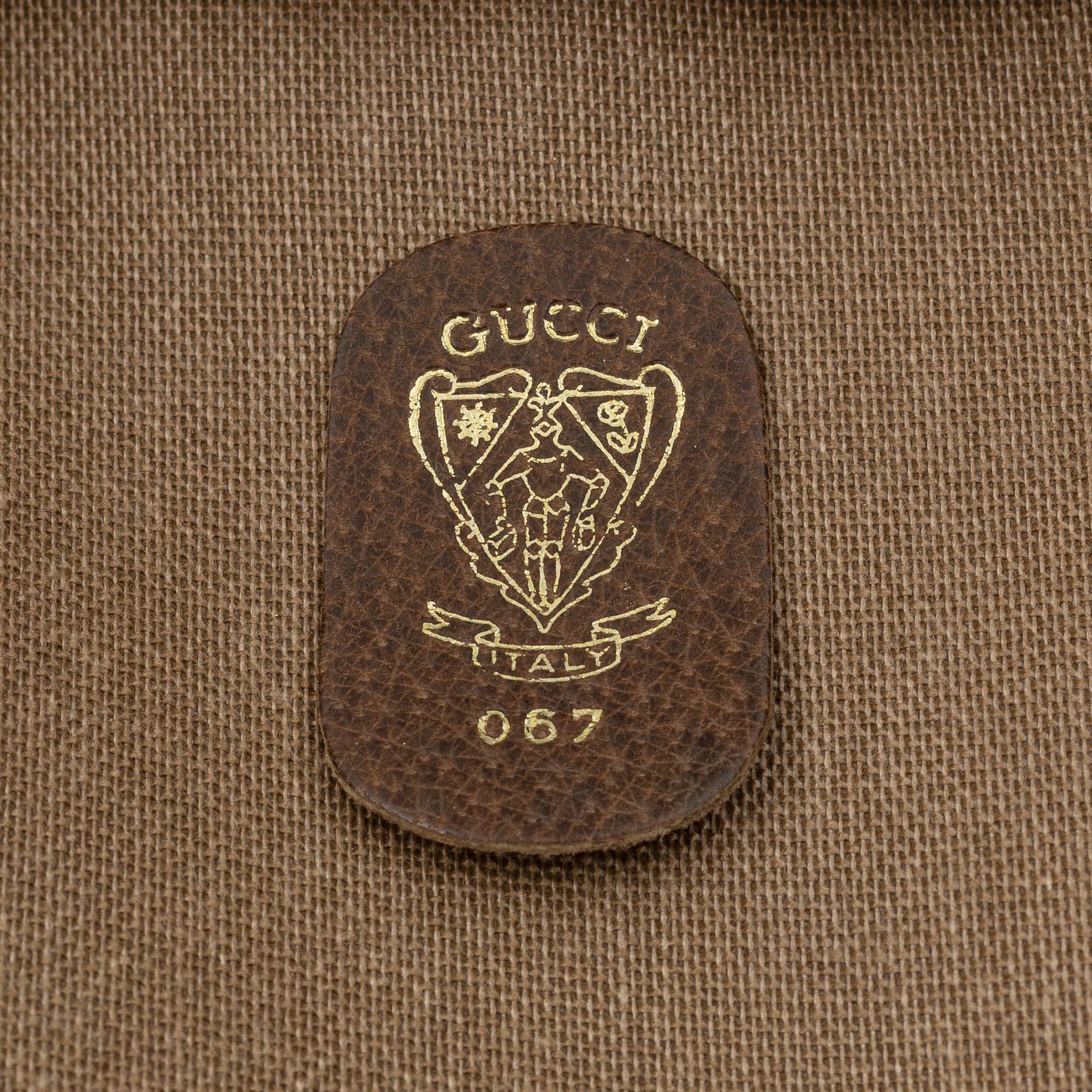 Gucci, a canvas weekend bag.