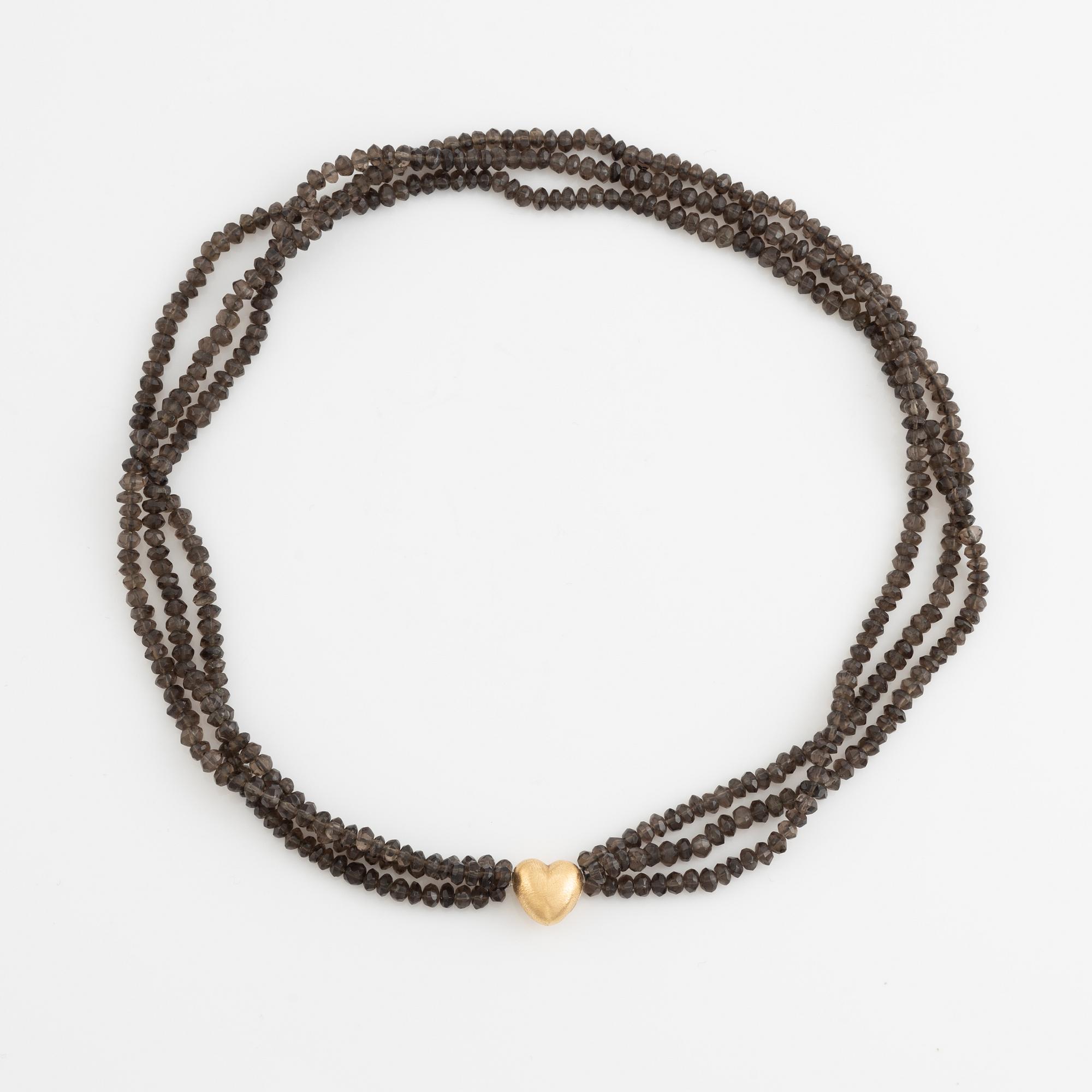 Ole Lynggaard,  smoky quartz necklace, clasp gold heart.