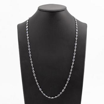 An 18K white gold necklace set  with faceted sapphires.
