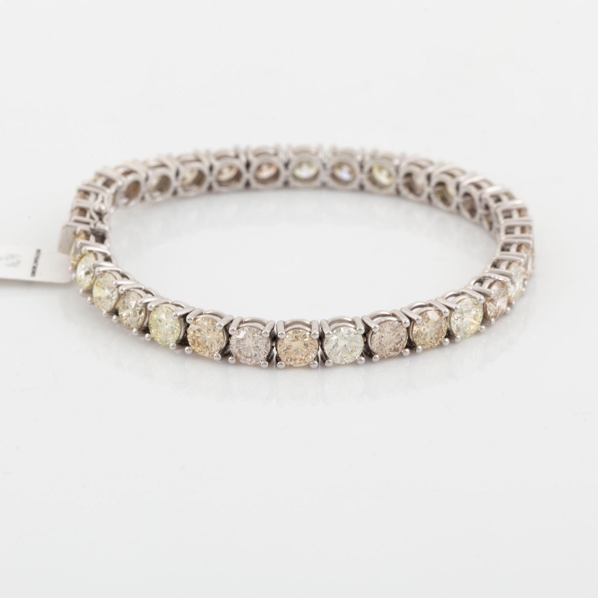 Round brilliant-cut diamond rivière bracelet, with IGI report.