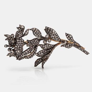 An 18K gold and silver spray brooch with single.cut diamonds ca. 6.40 ct in total. Third quarter of the 19th century.