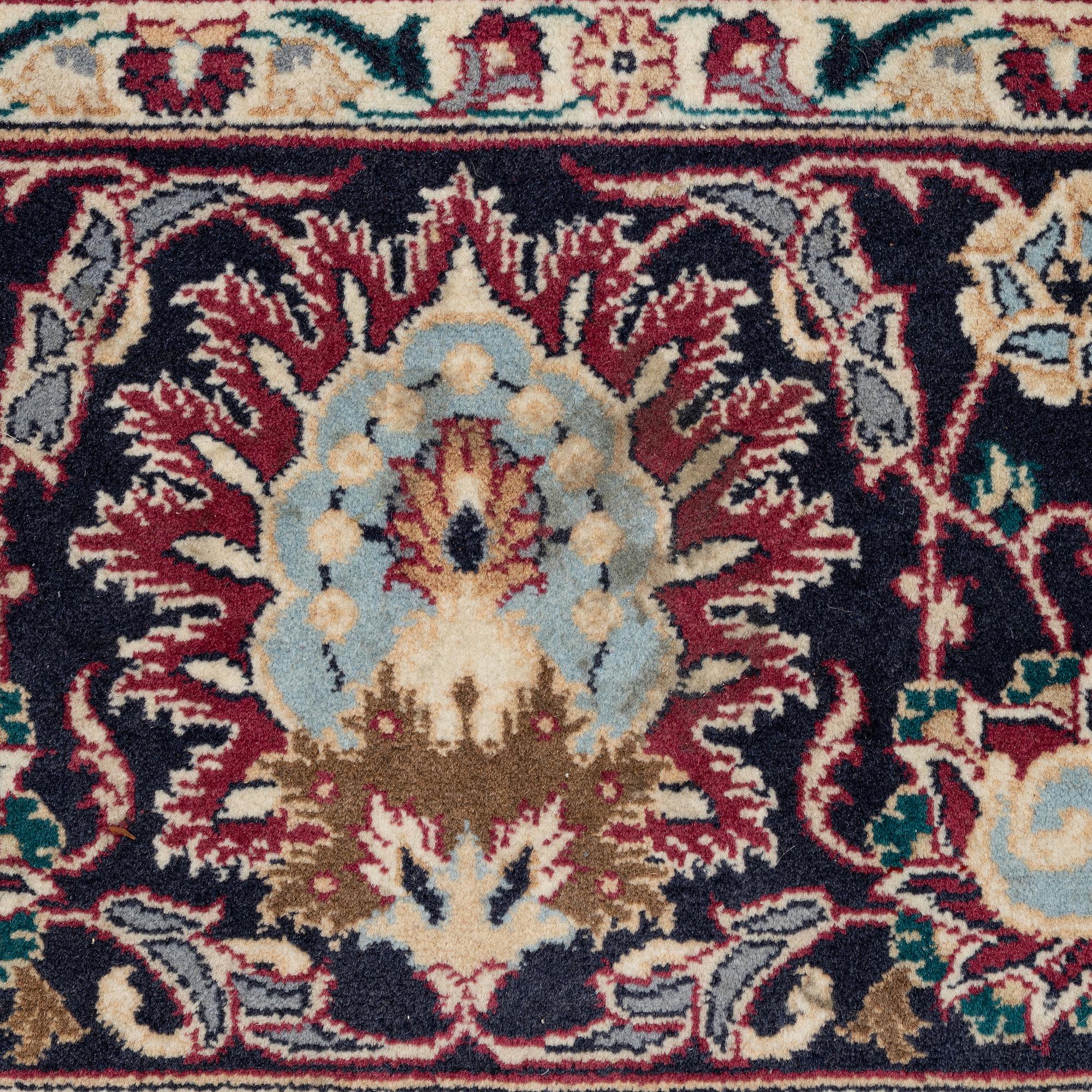 An oriental carpet, a. 378 x 278 cm.