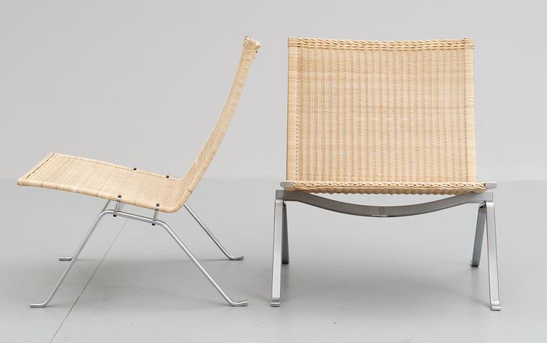 A pair of Poul Kjaerholm 'pk-22' steel and cane easy chairs, Fritz Hansen, Denmark 1995.