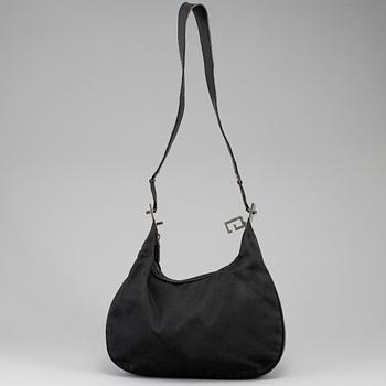 GUCCI, a canvas handbag.