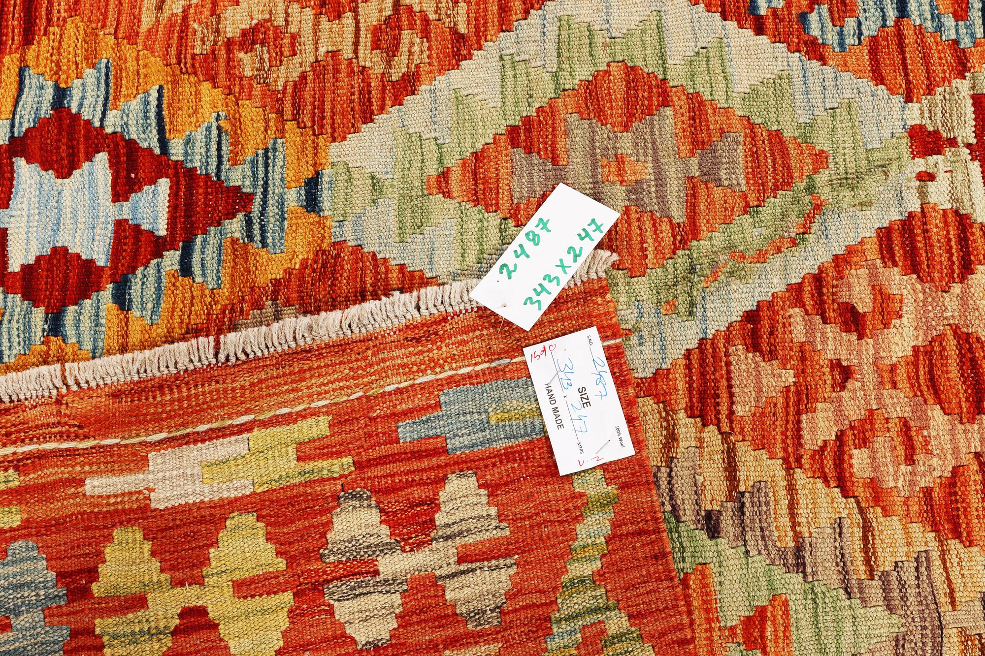 A Kilim carpet, c. 343 x 247 cm.
