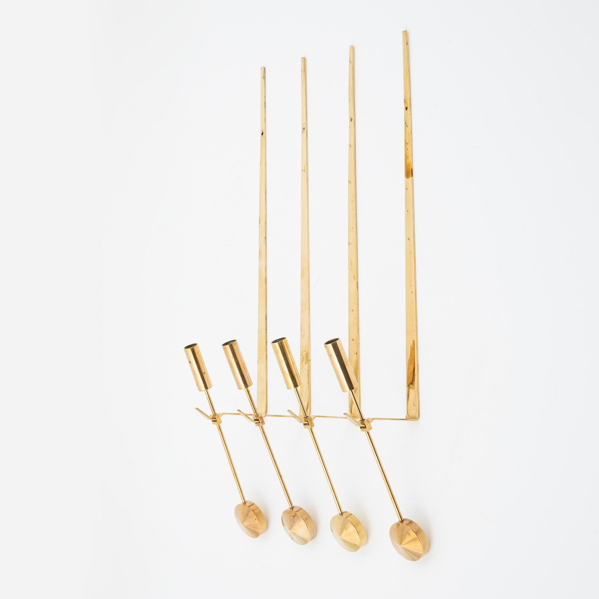 Pierre Forssell, a set of four brass 'Pendeln' wall lights from Skultuna, late 20th Century.