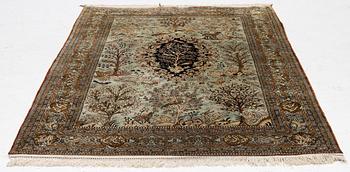 A Ghom, figural, silk rug, c. 205 x 140 cm.