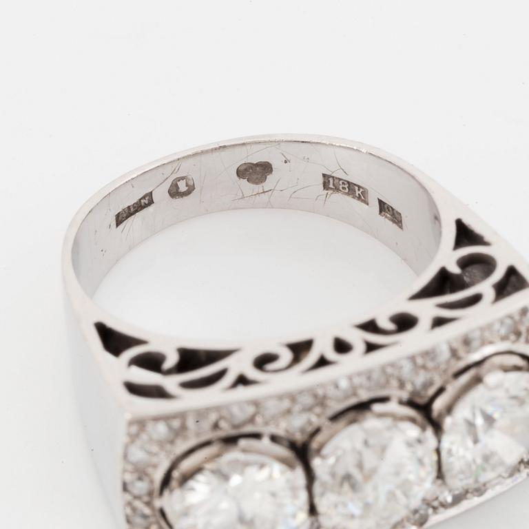 An 18K white gold ring set with old- and eight-cut diamonds.