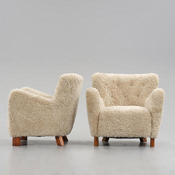 Fritz Hansen, a pair of easy chairs model "1669", Denmark, 1940s.